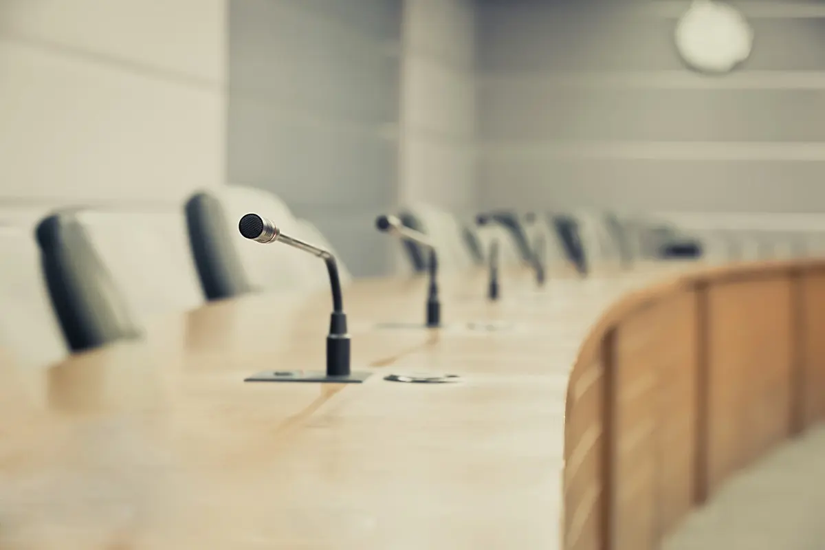 A boardroom microphone set for a board meeting held and minuted in the UAE