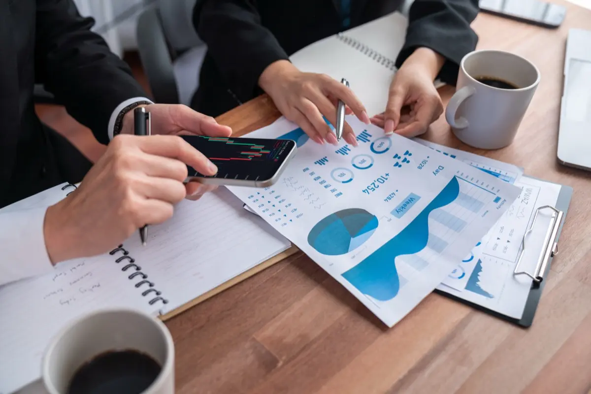 Fund managers reviewing a portfolio, the investment decision-making the FSRA expects to happen in ADGM